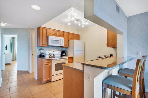 Stove, Oven, Microwave, Dishwasher, Blender, Coffee Pot, Kettle, and a Full Refrigerator.