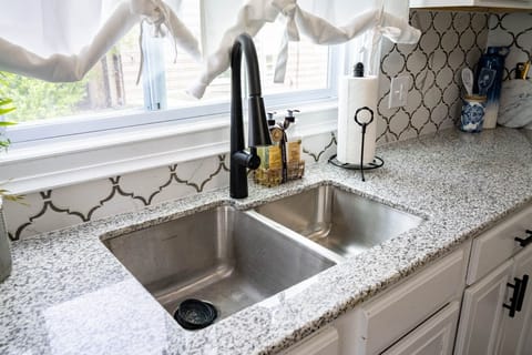 Double sink with natural light while washing dishes.