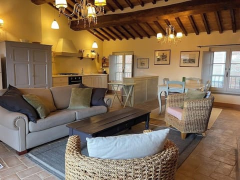 The main living area with the kitchen in the background