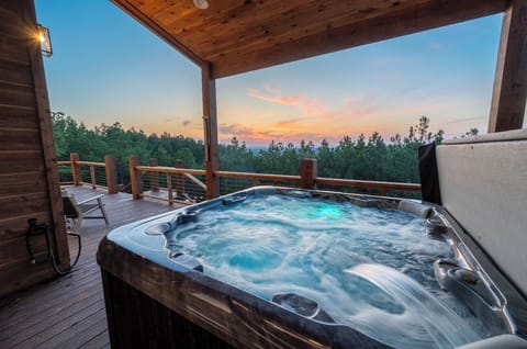 Forest views from the private hot tub — soak, unwind, and take it all in