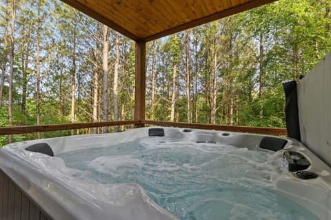 Relaxation Oasis: Unwind in the hot tub amidst serene forest views! Perfect for a tranquil getaway.