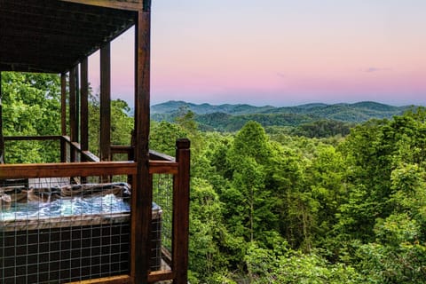 Welcome to your dream Smoky mountain escape! Enjoy luxe amenities, spacious decks and incredible hot tub views from a private and peaceful log cabin.