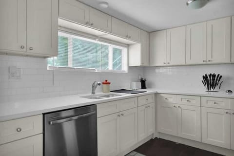 Furnished Kitchen with Full fridge, stove, microwave, silverware, plates & pots.