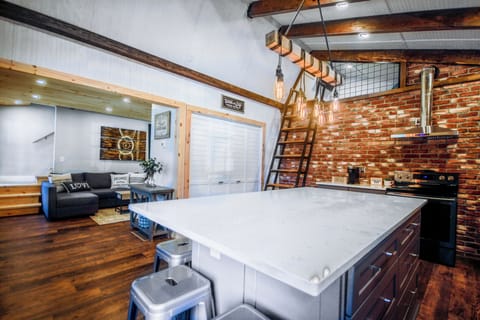 The kitchen looking at living room, loft and the closet has a washer and dryer
