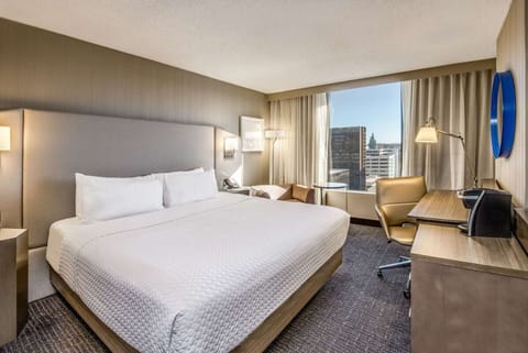 Wake refreshed to sunshine and skyline views from your king bed.