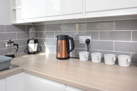 Enjoy hot beverages anytime with our convenient water heater and cups