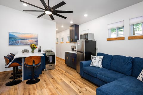 Enjoy the light-filled and stylish space with comfy seating and a functional kitchen!