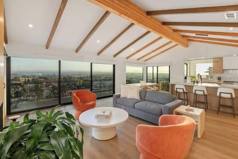 The great room, kitchen, and dining area with panoramic views of San Diego. 