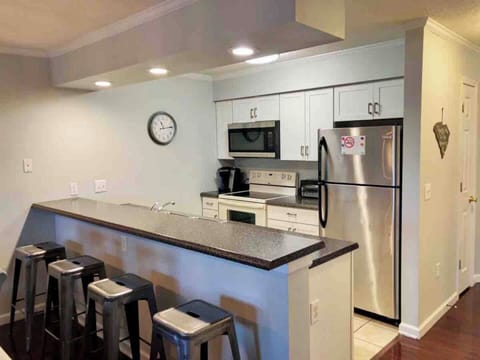 Kitchen with large breakfast bar.
 
