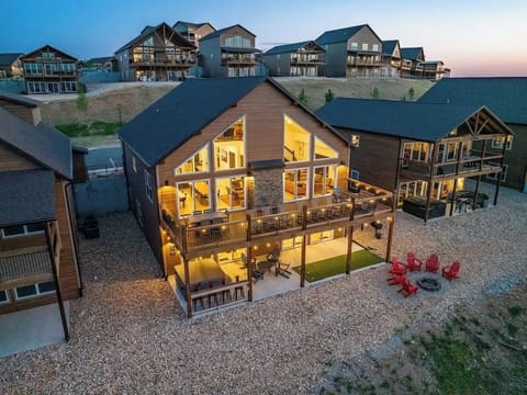 Twilight view with all of the lights on.  We carefully thought out the details so you have an optimal experience on your vacation!  Note the 8-person hot tub and putting green!