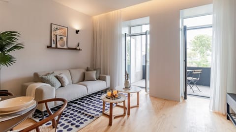Inviting living area with a dining table, comfortable couch, TV, access to the balcony, and an abundance of natural light, creating a bright and welcoming space for relaxation and entertainment.
#relax #comfort