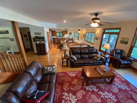 Large main floor living room. Adjacent to kitchen/dining, lake-side Fireplace