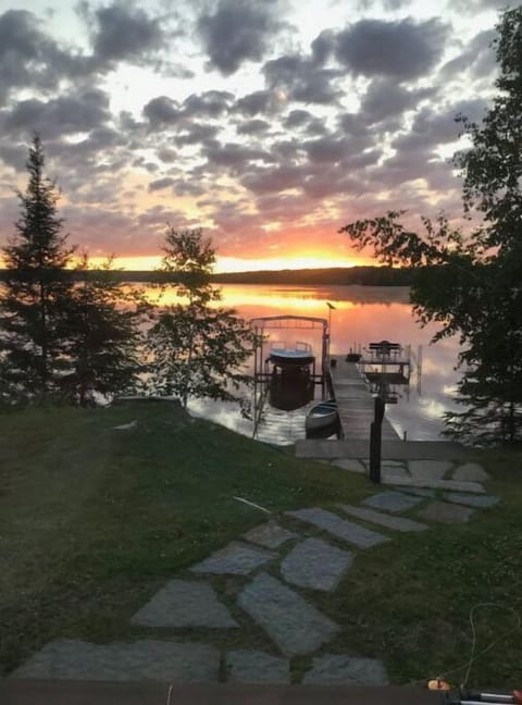 House sits right on the lake. Coffee at sunrise from the porch. private dock 55'