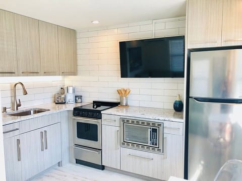 Fully equipped kitchen - not one, but two!!!  Each side of the duplex has private parking, a common patio, and individual kitchens, family rooms, bedrooms, bathrooms, etc.  Perfect for couples traveling together or family needing their own space. 