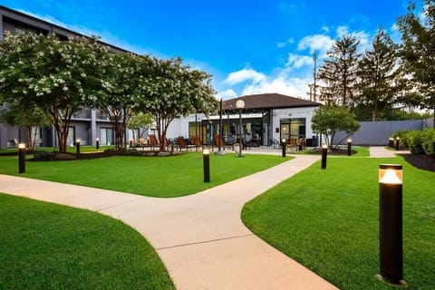 Wander curved walkways to the courtyard hub and seating.
