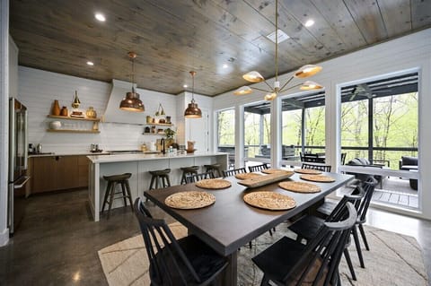 Dining Room: Gather around for delicious meals with stunning views through expansive windows!