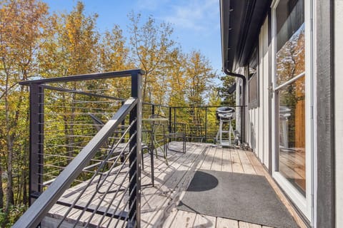 Private deck area off of the kitchen, perfect for grilling.