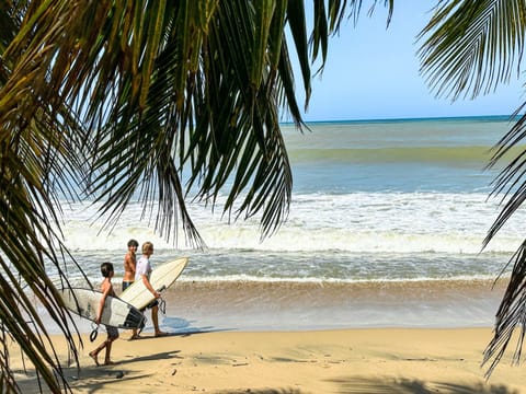Beach Vibes: Surf's up! Grab a board and hit the waves just steps from your getaway!