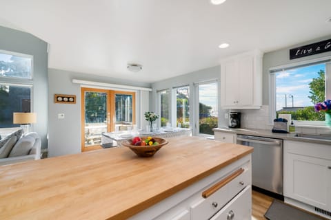 Fully equipped kitchen with Ocean views, breakfast bar and open to living and dining room.