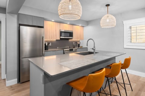 Comfortable island seating. Large refrigerator/freezer.