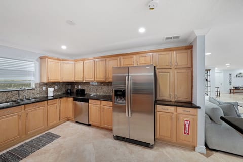 The kitchen boasts a modern and functional layout. For convenience, it's fully equipped with almost everything you need such as refrigerator, microwave, oven, cook stove, dish and silverware, plenty of storage space and counter tops.