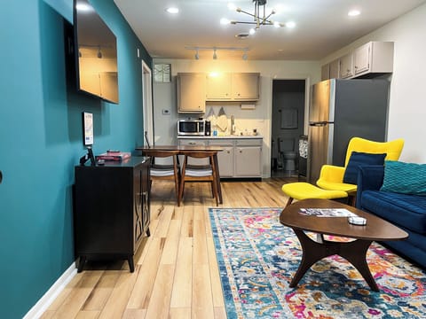 Step into a cozy and stylish space designed to make you feel right at home during your stay.  Sink into our plush and luxurious sofa and chairs, thoughtfully arranged to provide ample seating for all guests. Whether you want to relax with a book, watch your favorite shows on the flat-screen TV, or simply engage in pleasant conversations with your travel companions, this living ...