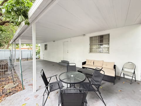 Spacious covered patio with outdoor dining and lounge seating