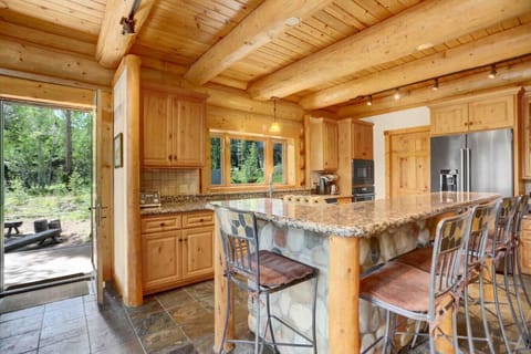 When you are preparing meals in this full functioning kitchen, you feel like you are part of the surroundings with the large picture window.