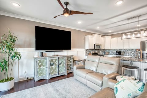 85 Inch Smart TV can be Viewed from the Kitchen, DIning Areas, and Living Room.