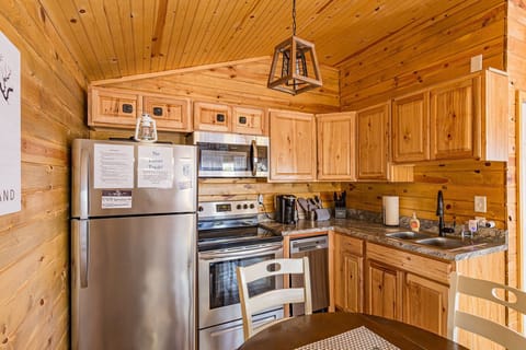 Kitchen and Fridge with typical cooking items. Plus single cup keurig.