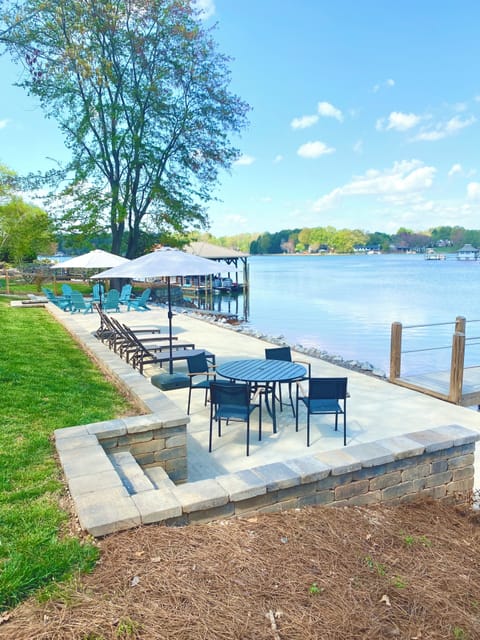 Lakeside patio with beach beyond