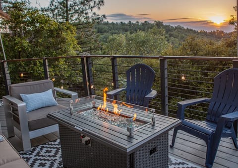 Deck by the outdoor fireplace overlooking sunset