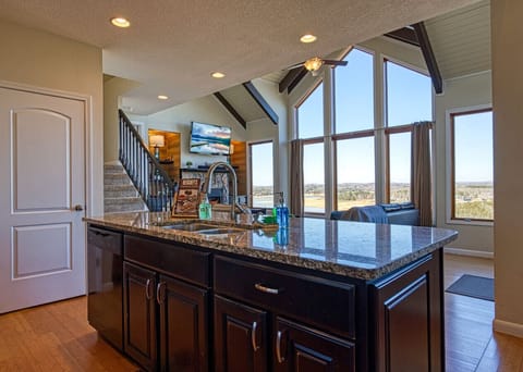 With this open kitchen, you can connect with the guests in the living room, have views of Douglas lake, and have space to prepare fantastic meals in our fully stocked kitchen!