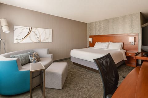 Settle into a cozy king room with lounge seating.