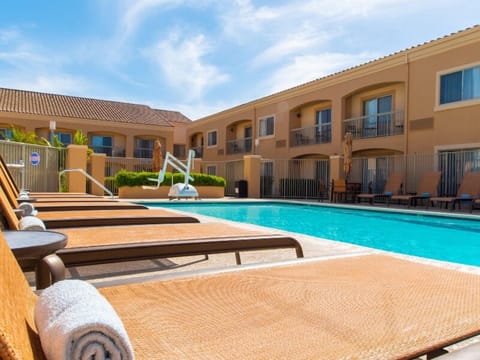 Soak up the sun on loungers beside the sparkling pool.
