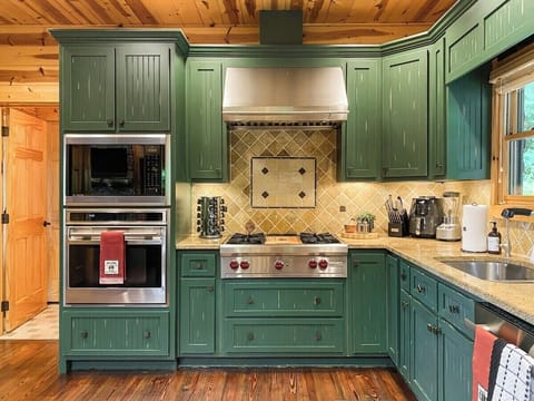 Charming custom cabinetry and a fully equipped kitchen means…