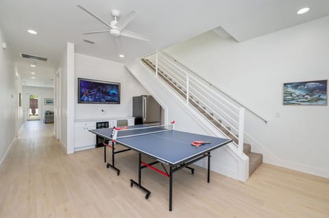 1st floor entertainment with full size fridge, bev center, freestanding ice maker, flat screen TV!