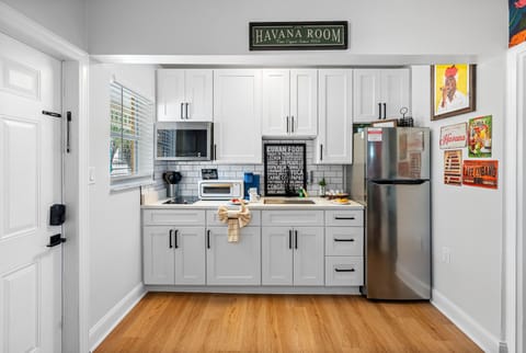 The fully functional kitchen is a highlight, equipped with modern appliances and all the essentials for your culinary needs.