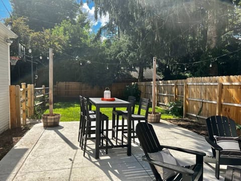 Patio and fenced backyard