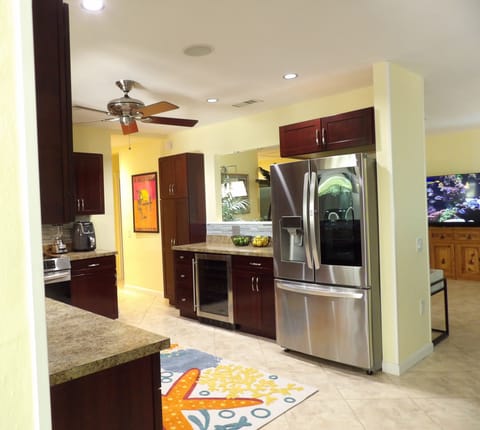 French door fridge, wine chiller, complete cookware, dinnerware, service ware.