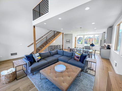 Open floor plan with vaulted ceilings and windows all around for an airy vibe.