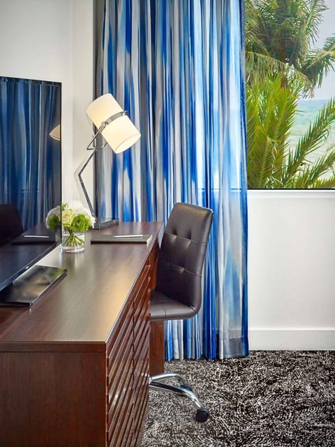 Sip morning coffee at the desk with tropical views.