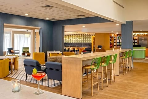 Gather with friends over drinks at the lively communal bar.