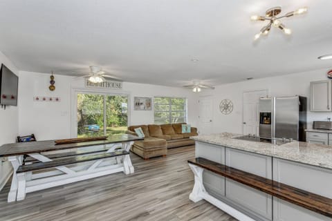 Large open floor plan, LVP flooring, large flat screen