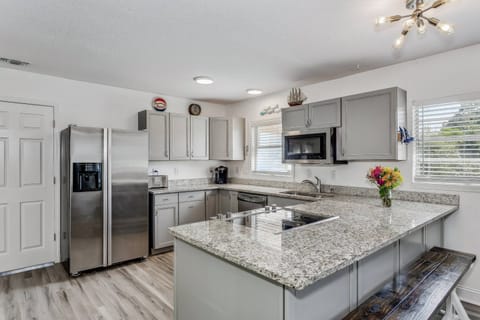 The kitchen has been completely updated with granite counters and high end stainless steel appliances