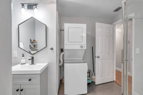 Stackable Washer and Dryer Located in Bathroom off of Dining Room