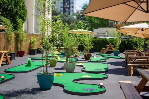 Unwind outdoors with playful mini-golf and sunny seating.