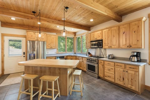 Fully Stocked Kitchen with Kitchen Island and Breakfast Bar
