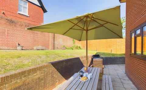 Garden with patio and outdoor dining and BBQ.