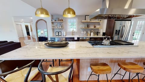 Gourmet Kitchen with an 8-burner Gas Range, 2 Dishwashers and 2 Refrigerators